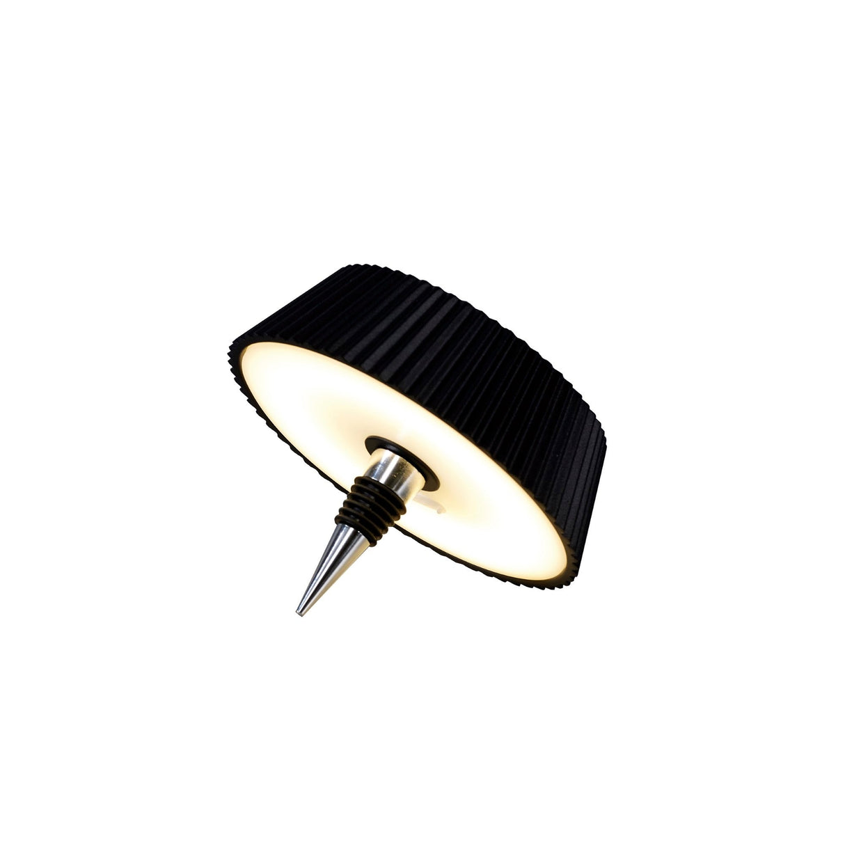 The Relax Touch Dimmable LED Battery Bottle Outdoor Table Lamp in black features a modern round design with a ridged casing, glowing white center, and pointed metal stake—perfect for outdoor use.