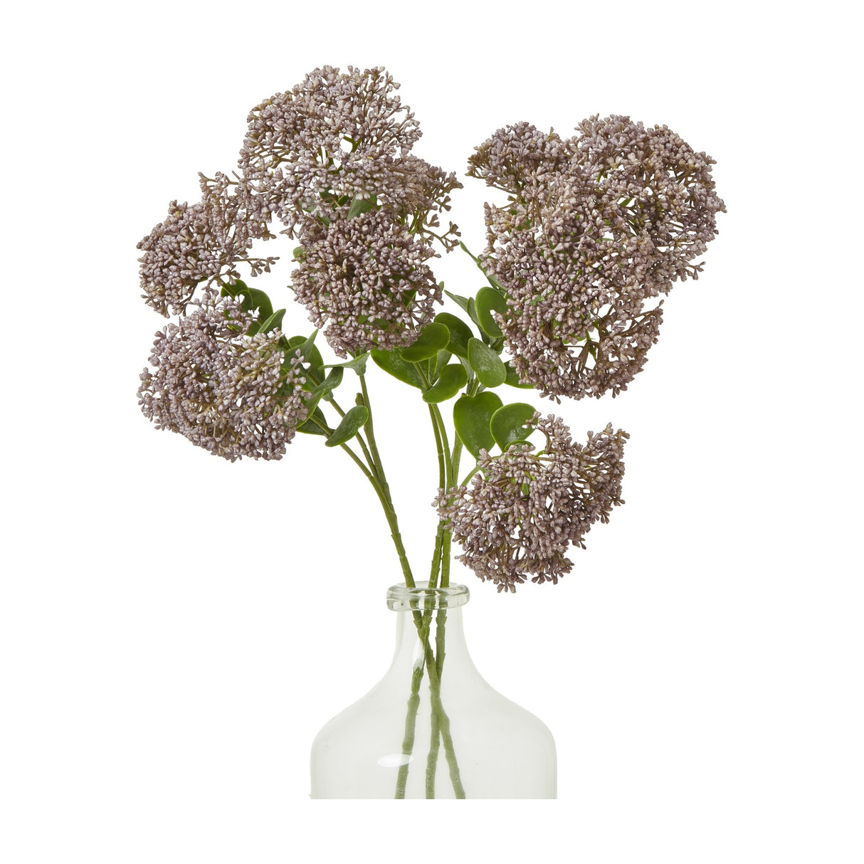 Hill Interiors Purple Sedum Spray faux stems with clustered mauve florets and green leaves arranged in a clear glass bottle vase on a white background.