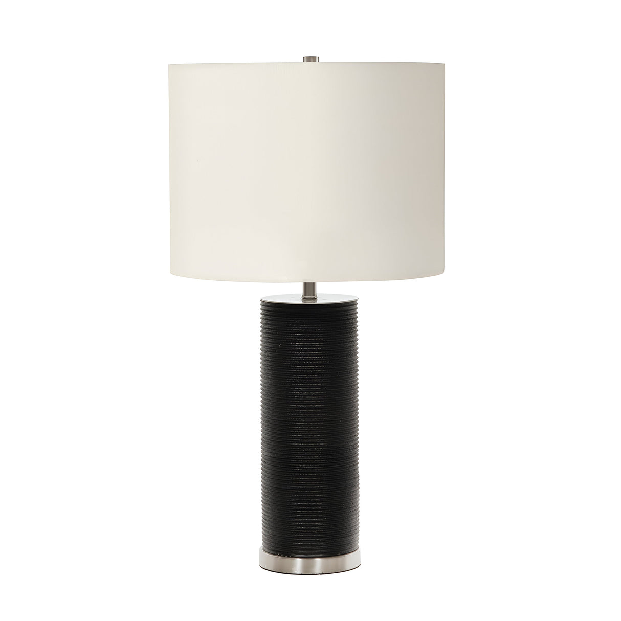 The Ripple 1 Light Table Lamp in black, featuring a cylindrical textured base and a sleek metallic bottom edge, enhances any space with its contrasting decor. Topped with a large, simple white drum-shaped lampshade, it captures modern design to create a clean, contemporary look.