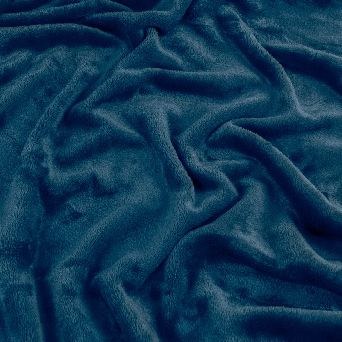 Close-up of the Harrow Plain Polyester Throw in midnight blue, showing the soft flannel fleece surface with folds revealing subtle tonal depth.