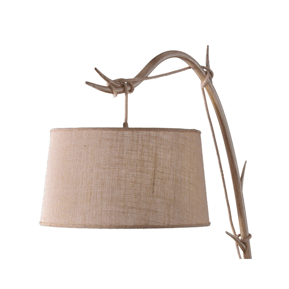 The Sabina 1 Light Floor Lamp features a curved brown base and a beige linen shade against a white background—an ideal rustic accent for bohemian decor.