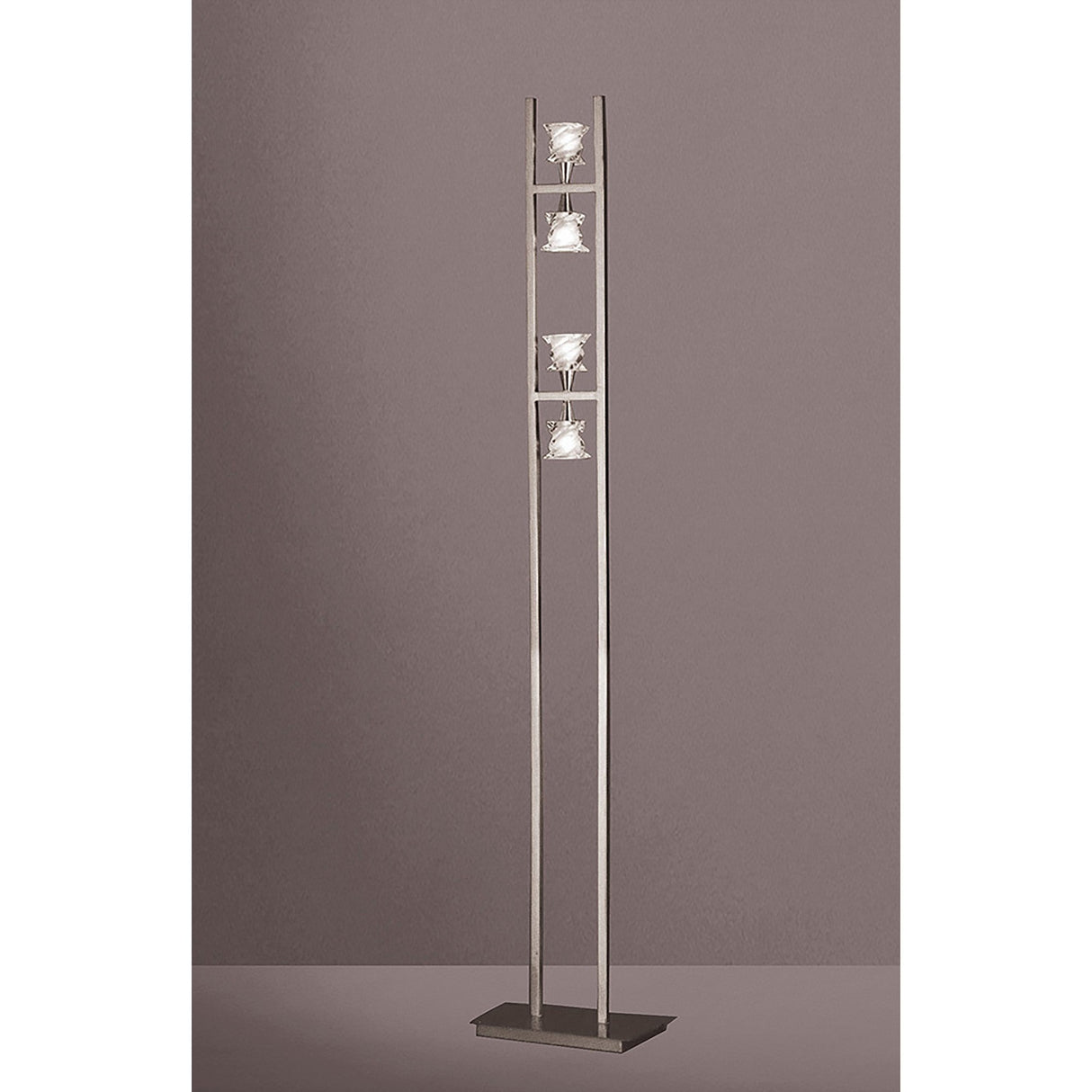 The Salomon 4 Light Floor Lamp in Satin Nickel features a minimalist design with two vertical metal bars, three square lampshades arranged vertically, directional lighting, and stands on a rectangular base.