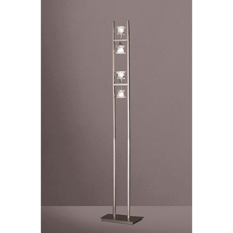The Salomon 4 Light Floor Lamp in Satin Nickel features a minimalist design with two vertical metal bars, three square lampshades arranged vertically, directional lighting, and stands on a rectangular base.