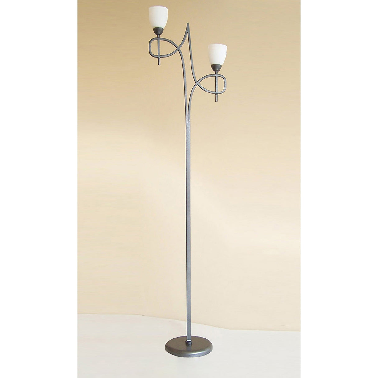 The San Marino 2 Light Opal Glass Floor Lamp features a textured pewter base and stem with two upward-facing opal glass shades on curved arms, set against a plain beige background.