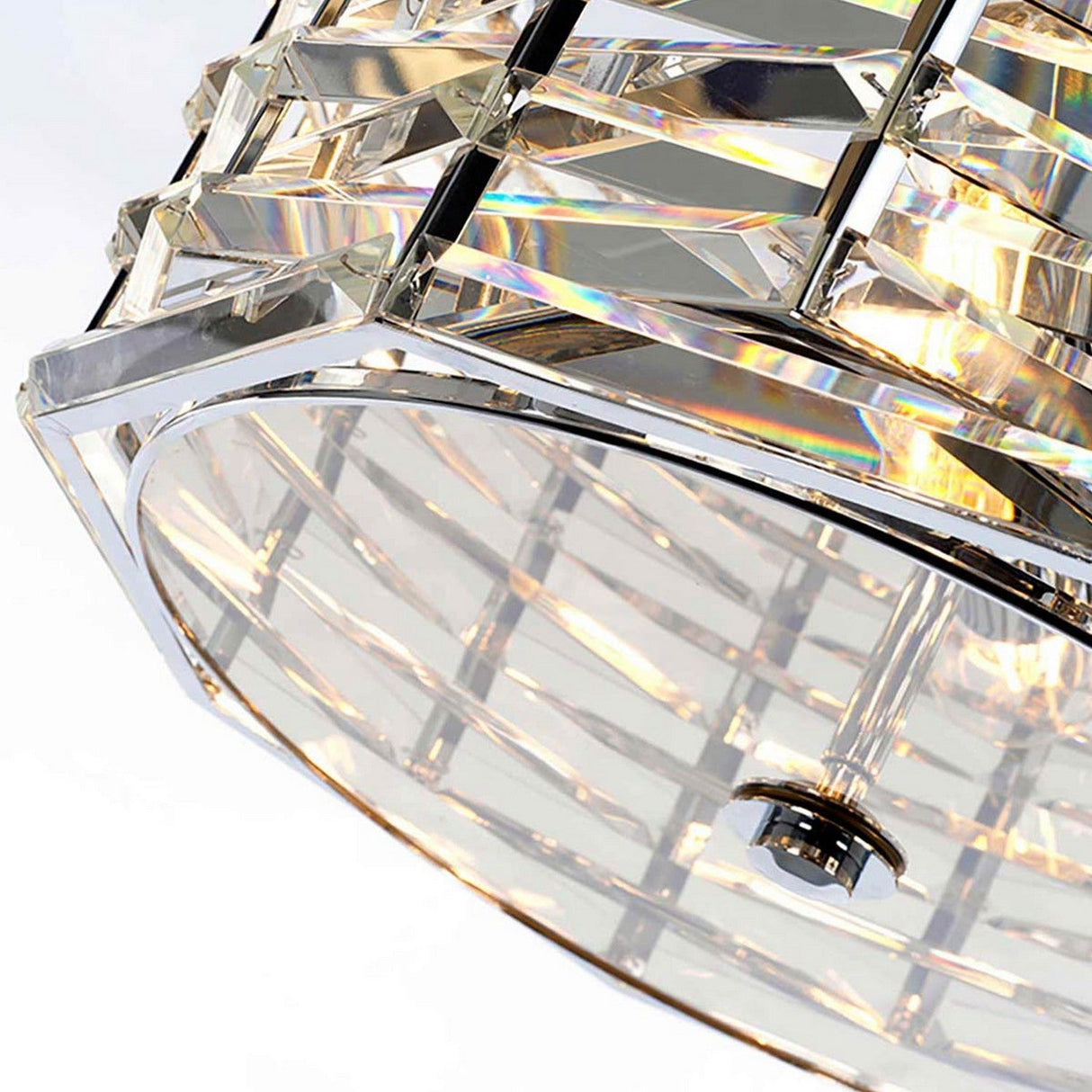 Close-up of the Shoal 4 Light Chandelier - Polished Nickel, featuring geometric glass panels and a sleek metallic framework. The light elegantly passes through the glass, creating a prismatic effect with vibrant colors, enhancing any luxury lighting setting with an exquisite touch.