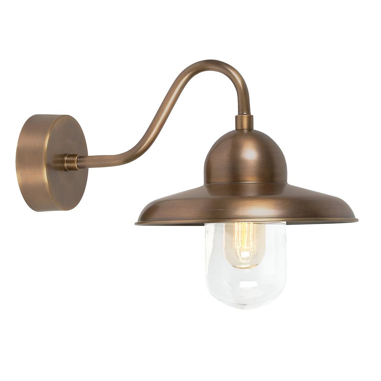 The Somerton 1 Light Outdoor Wall Light - Aged Brass offers a vintage design, featuring a rounded shade and clear glass cover that encases an exposed bulb. It is elegantly attached to a curved arm and circular base, with its standout aged brass finish enhancing its classic appeal.