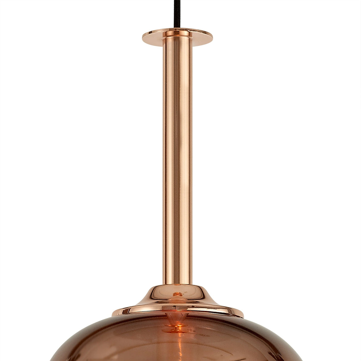 Close-up of the Mantra Sonata pendant light's polished copper canopy, slim stem and top of the copper-tinted hand-blown glass shade.