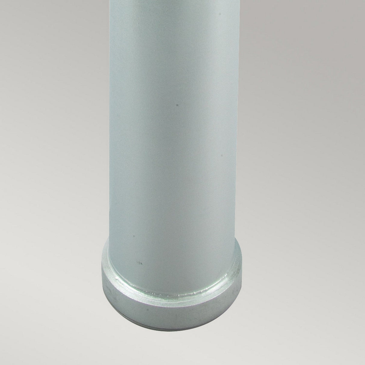 A close-up view of the bottom portion of the Stockholm Large Bollard - Silver, highlighting its sleek finish against a plain gray background.