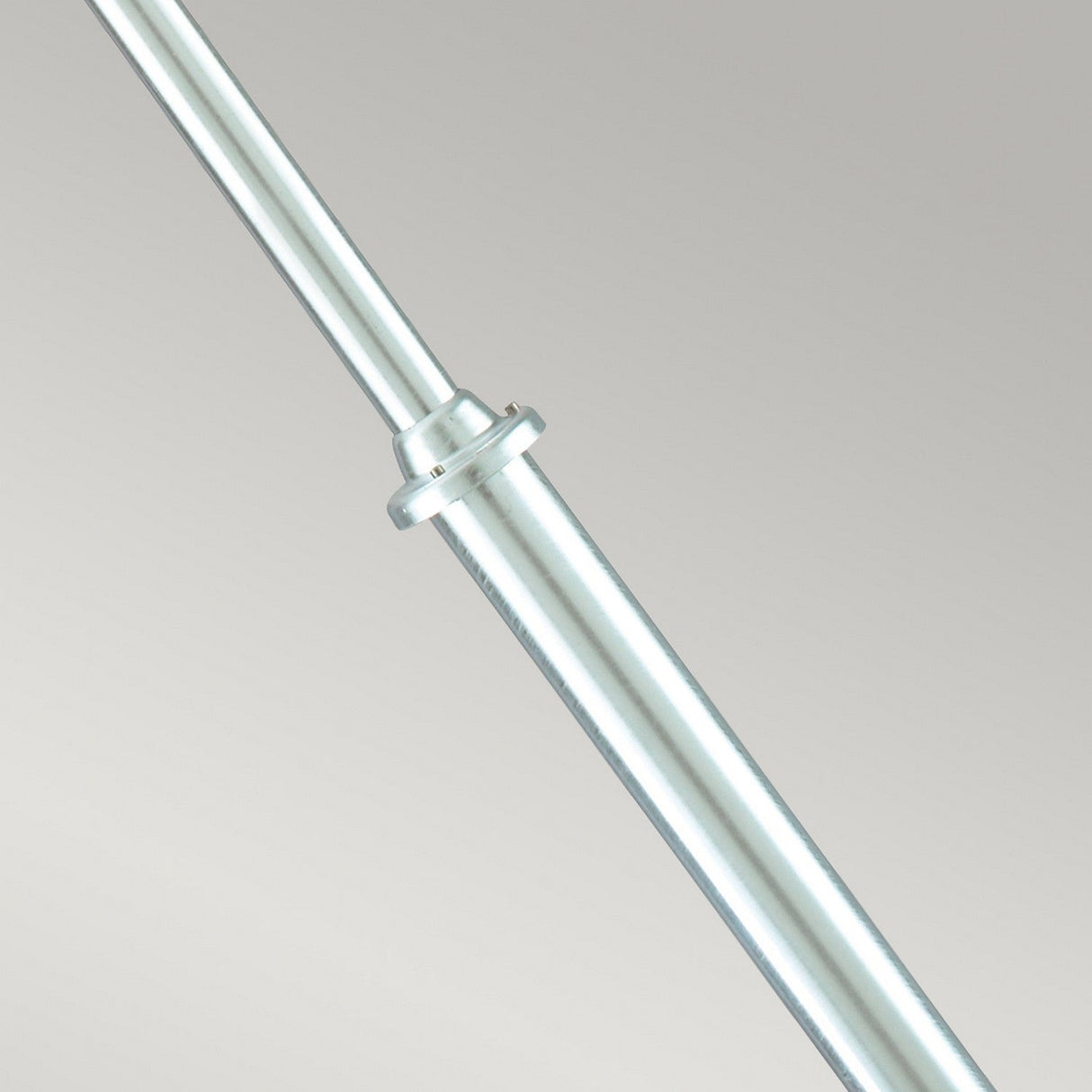 A Stockholm 1 Light Grande Lamp Post in silver is displayed close-up against a plain, light gray background. Crafted from galvanized steel, the lamp post features a smooth, metallic finish, ensuring durability and resilience.