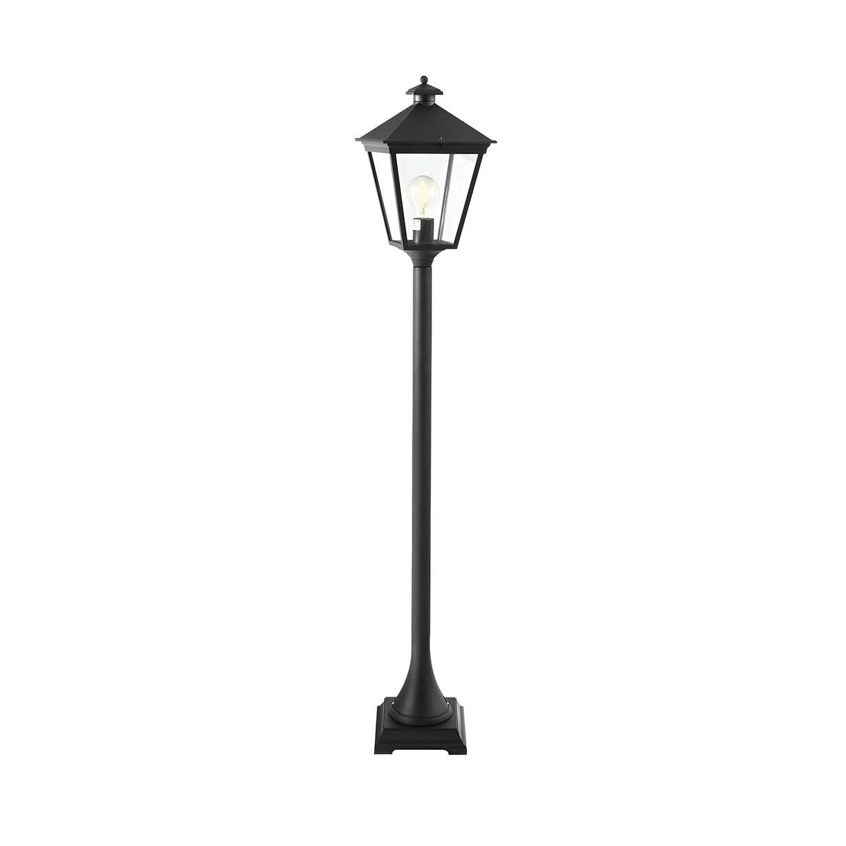 The Turin 1 Light Pillar - Black is a tall, outdoor lamp post featuring a classic lantern design. It is crafted from die-cast aluminum with clear glass panels that reveal a visible light bulb inside. Positioned on a square base, this lamp is perfect for enhancing outdoor landscapes against a plain white background.