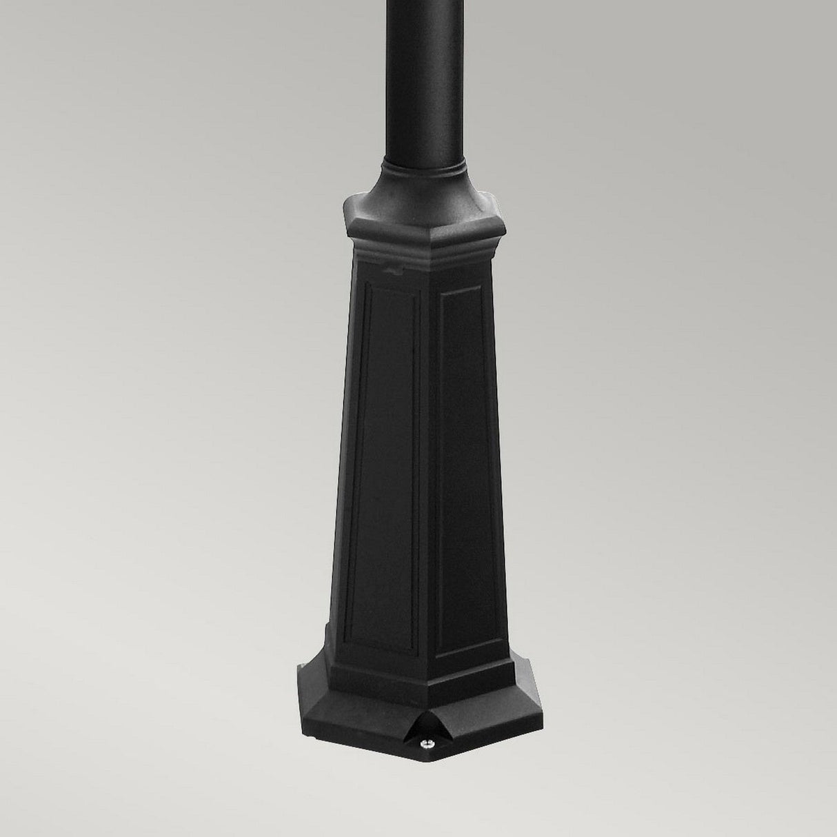 The Turin 3 Light Triple Lamp Post - Black, featuring an octagonal base with engraved panels and a smooth finish, stands gracefully against a plain grey background—perfect for enhancing garden illumination or as part of elegant outdoor lighting.