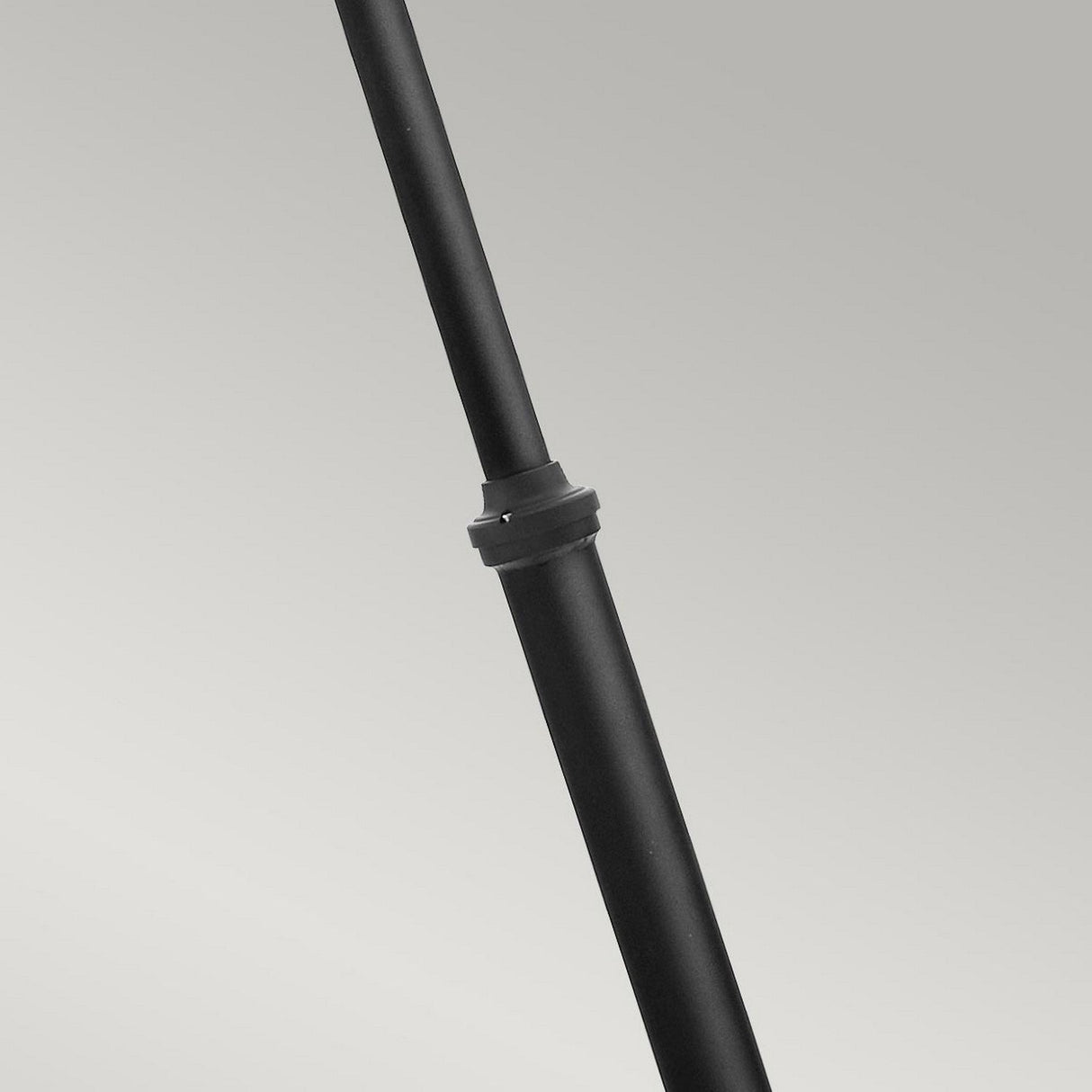 A close-up of the Turin 3 Light Triple Lamp Post in black, resembling a sleek telescopic rod, set against a neutral gray background.