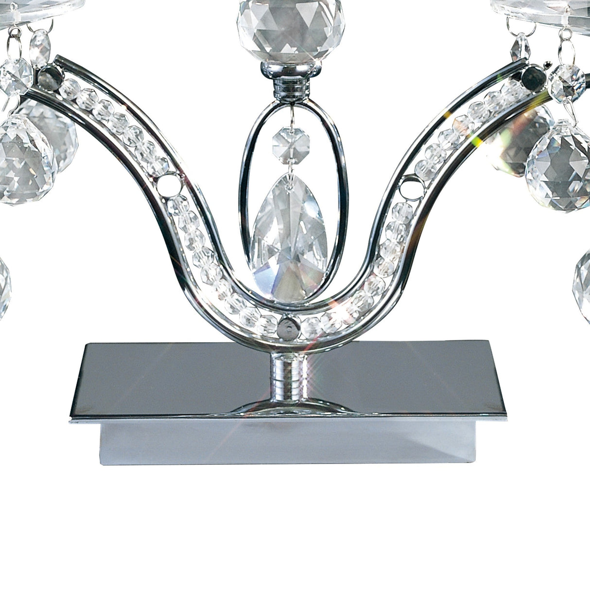 A close-up of the Tara 2 Light Crystal Table Lamp in polished chrome, featuring rows of clear crystal embellishments and hanging pendants that reflect light on its shiny metal base.