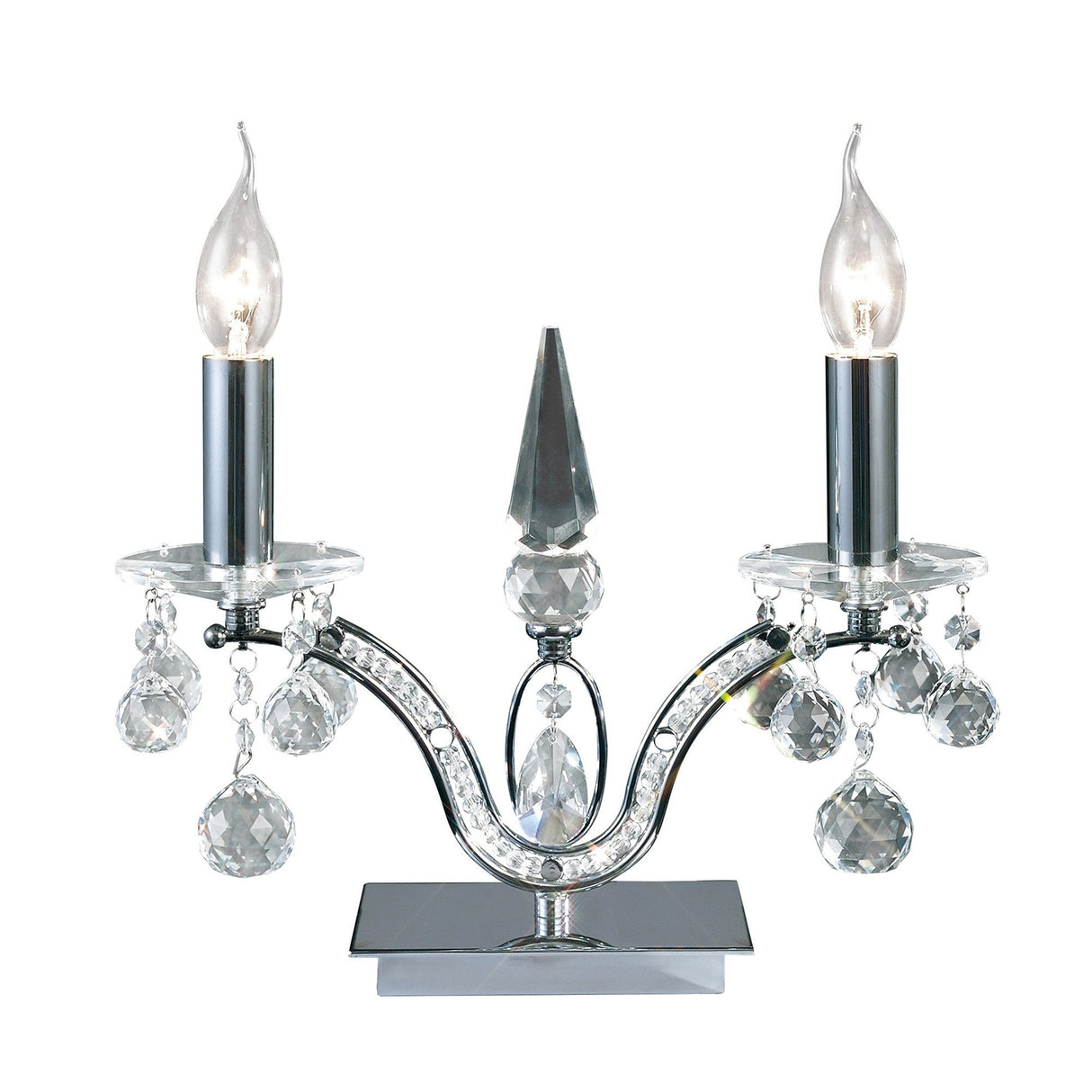 The Tara 2 Light Crystal Table Lamp in polished chrome features two arms with flame-shaped bulbs and sparkling crystal accents, all set on a reflective rectangular base against a white background.