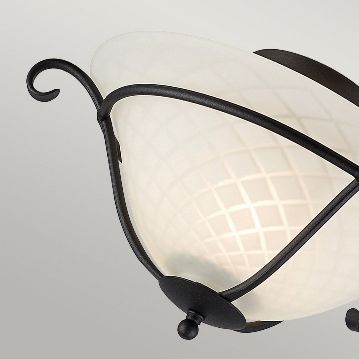The Torchiere 1 Light Flush - Black/Opal Etched Glass ceiling light fixture features opal etched glass and black metal accents with a curved design and a round knob at the bottom, exuding a touch of Gothic charm.