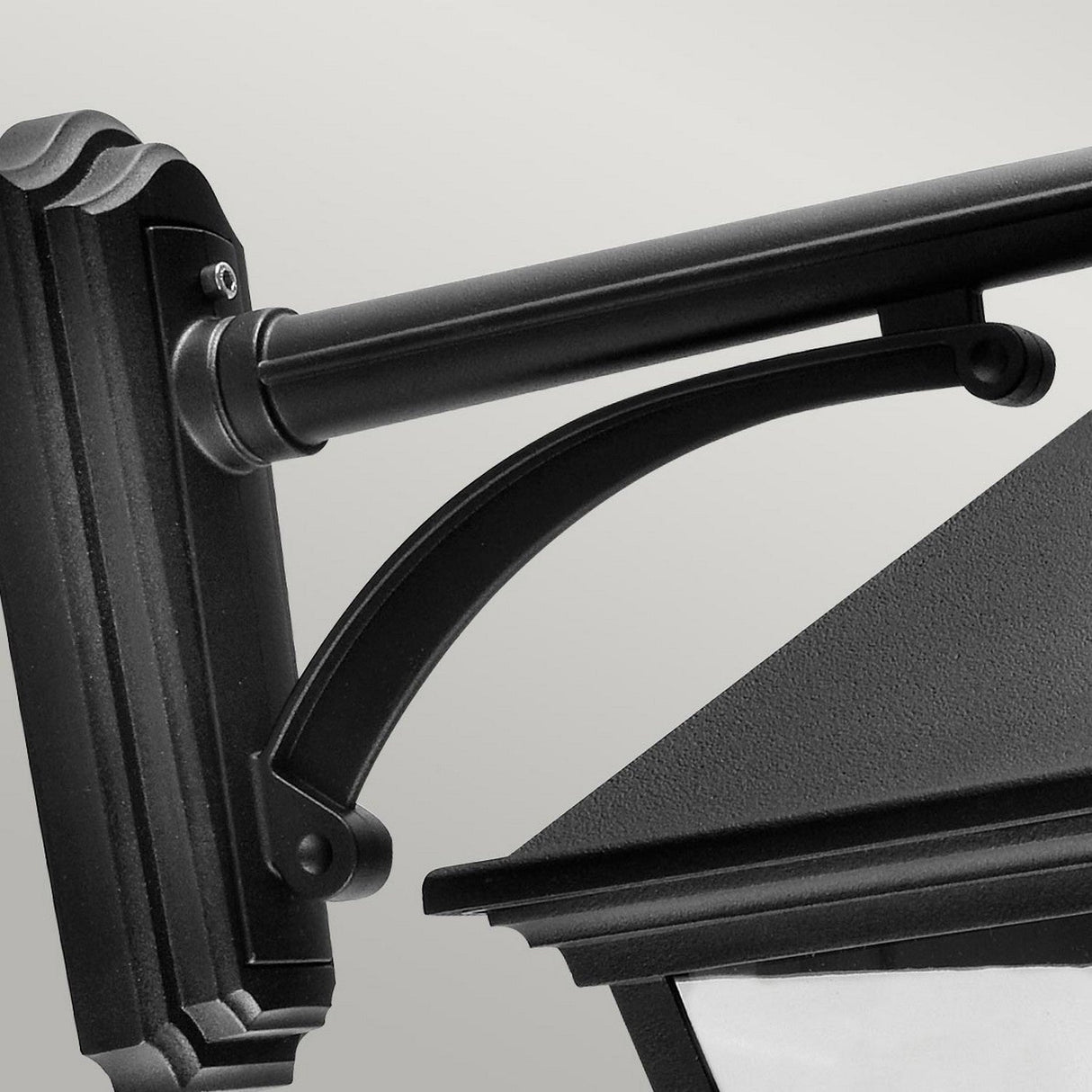 Close-up of the Turin Large Outdoor 1 Light Down Wall Lantern in black, featuring a curved support arm and rectangular backplate with a black powder-coated finish. Set against a plain light gray background, this wall-mounted lantern also offers an impressive weather resistance rating.