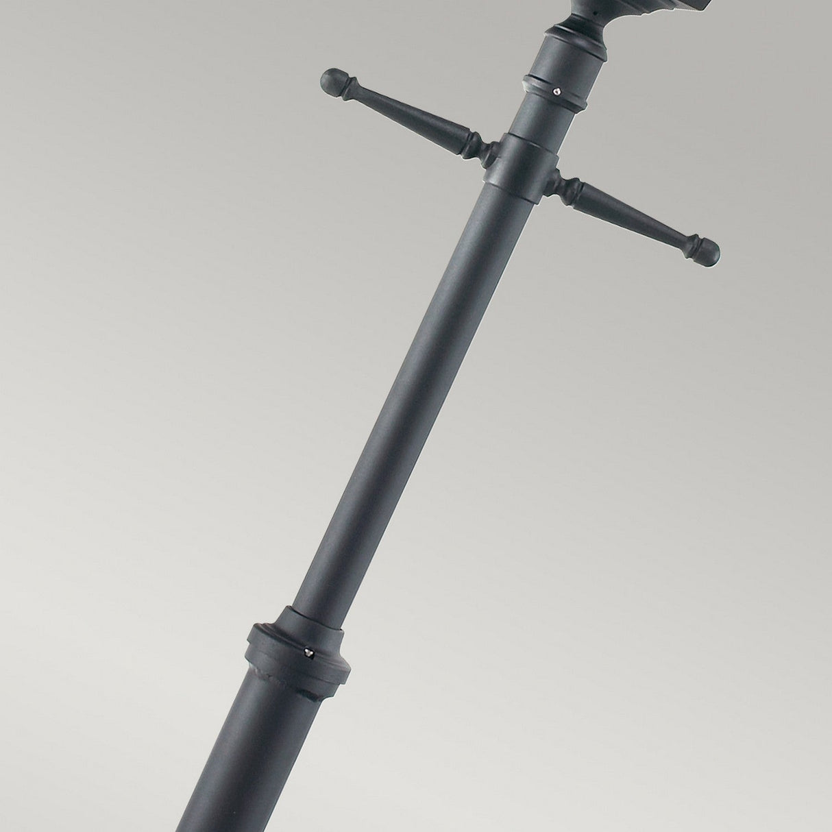 Close-up of the Turin Large 1 Light Single Post in black, featuring adjustable knobs and constructed from die-cast aluminum, set against a plain background. Its sleek design suggests versatility for supporting audio or camera equipment while offering durability comparable to outdoor lighting standards.