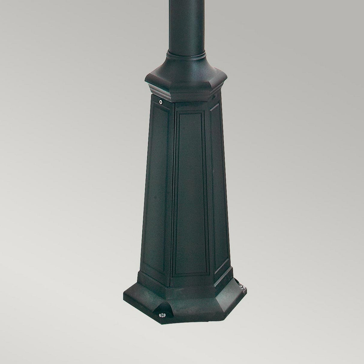 A close-up of the base of the Turin Large 2 Light Twin Lamp Post - Black, crafted from durable die-cast aluminum with a hexagonal shape against a plain gray background.