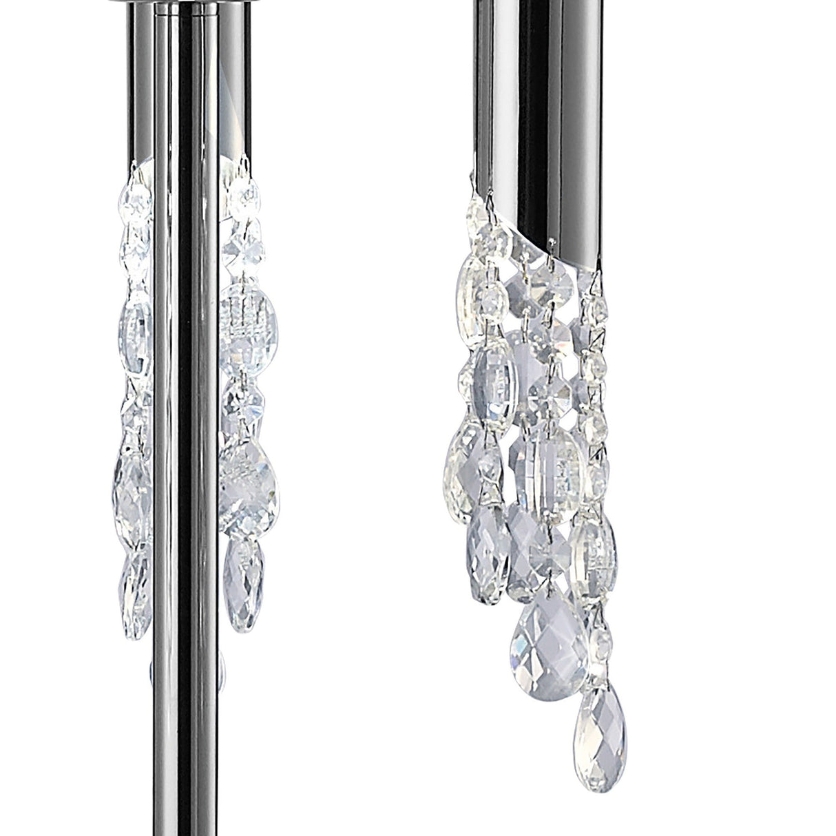 The Tiffany 6 Light Crystal Floor Lamp features sleek chrome rods with clear faceted crystal droplets, reflecting light for a sparkling effect. Its modern design and white shade stand out against a plain white background.