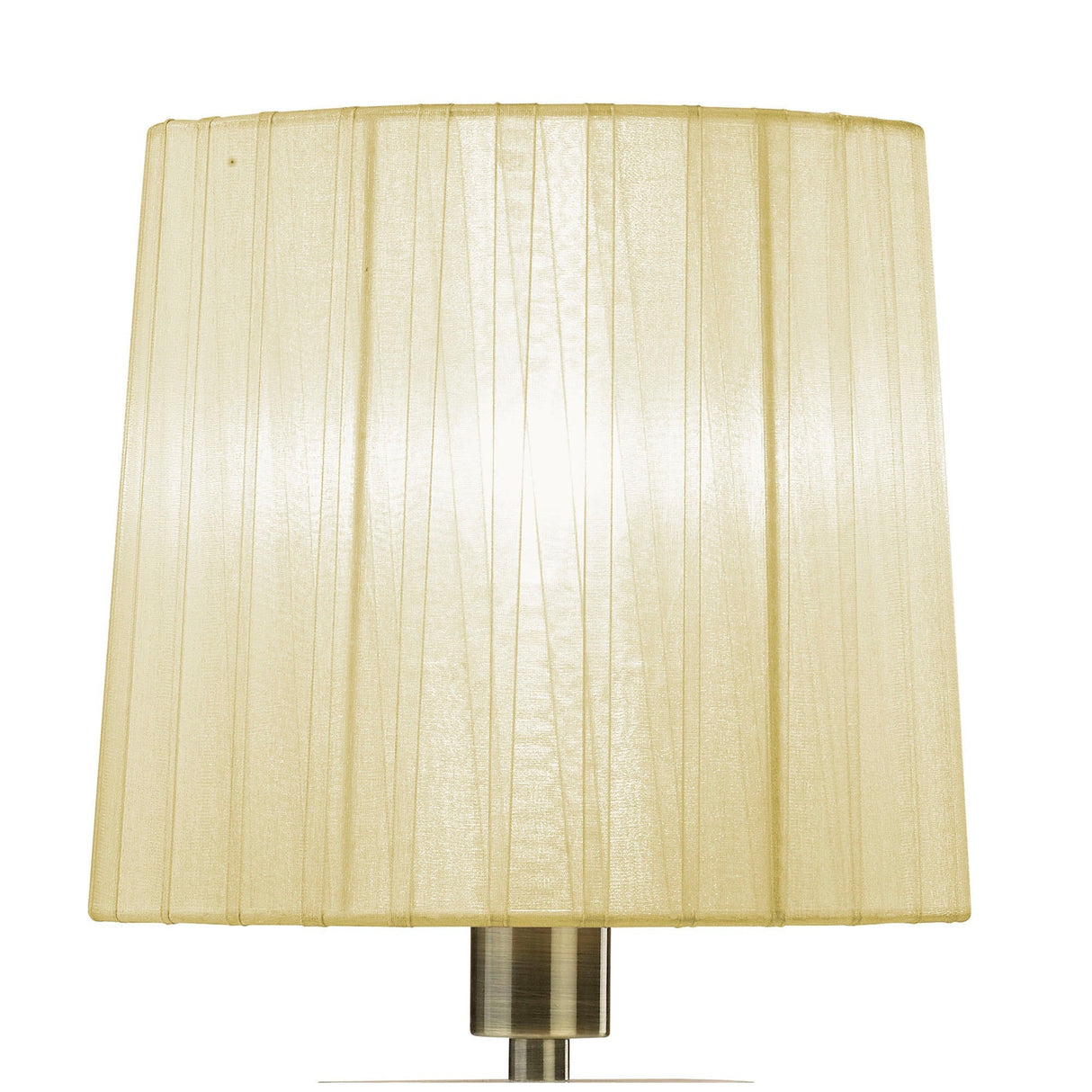 A close-up of the Tiffany 2 Light Crystal Table Lamp shows its cream shade glowing with light over a brass base. Vertical stitched lines on the lampshade add texture and sophistication to this elegant table lamp.