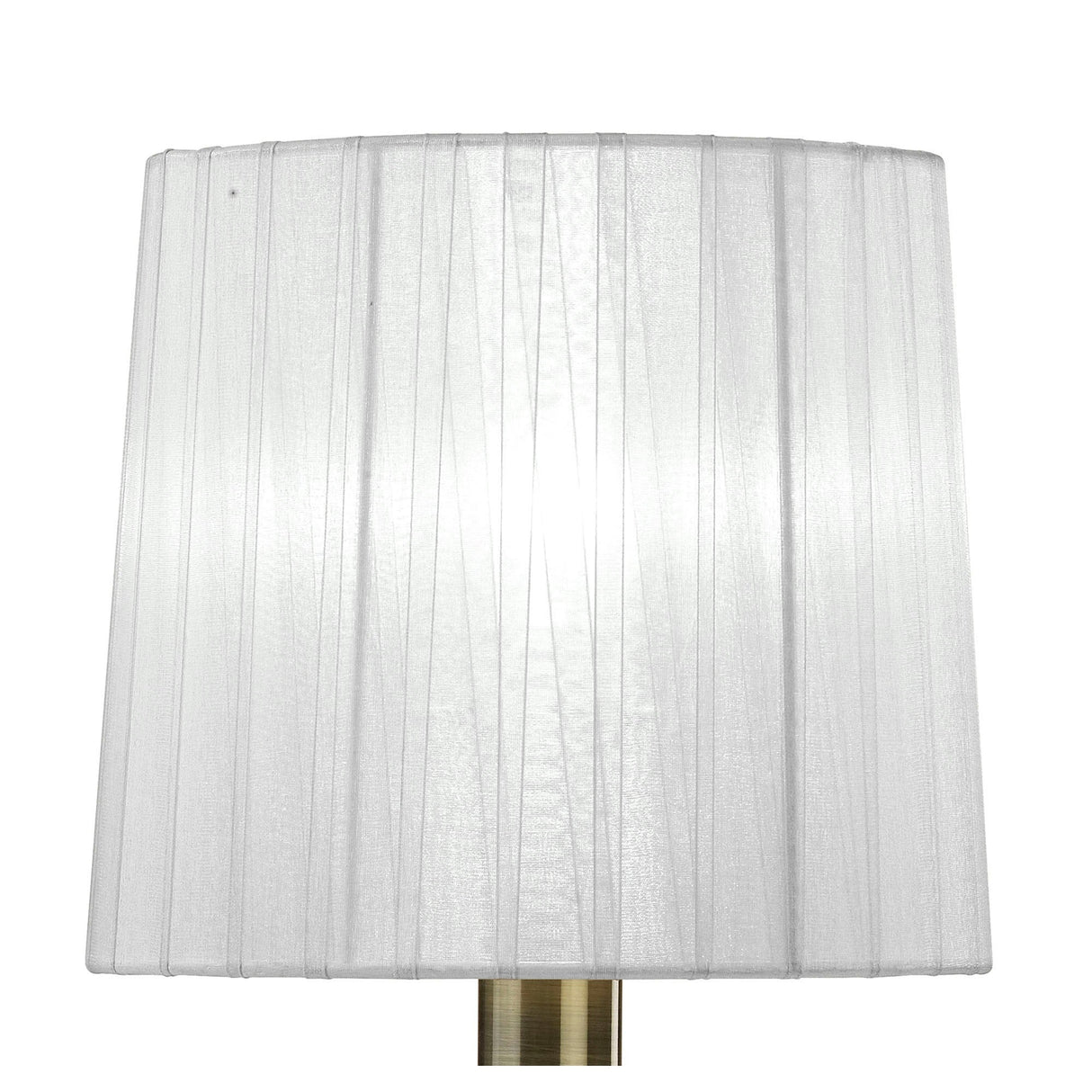 A close-up of the Tiffany 2 Light Crystal Table Lamp featuring a brass base and a white pleated shade, softly illuminated against a plain white background.