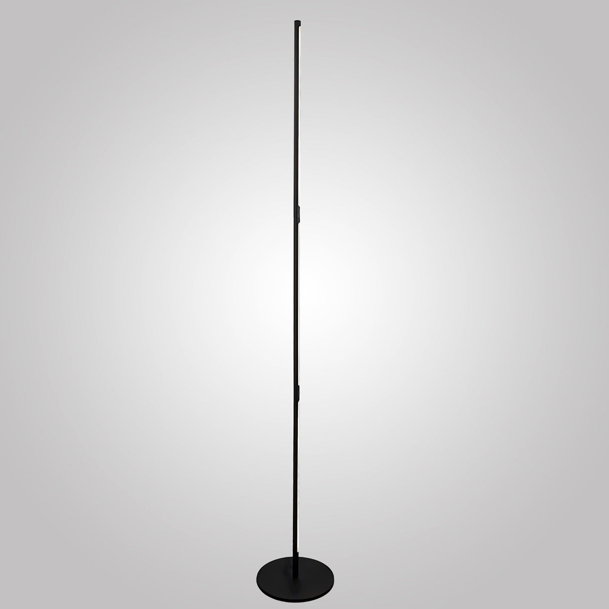The Tsunami LED Floor Lamp 25W 3000K in Sand Black stands tall and slim with a round base against a light gray gradient background, ideal for minimalist modern interiors.