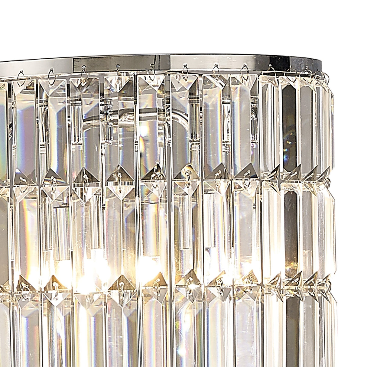 Close-up of the Torre 5 Light Crystal Curtain Floor Lamp with vertical, rectangular crystal prisms in two rows set in a polished chrome frame, beautifully illuminated as light shines through the crystals.