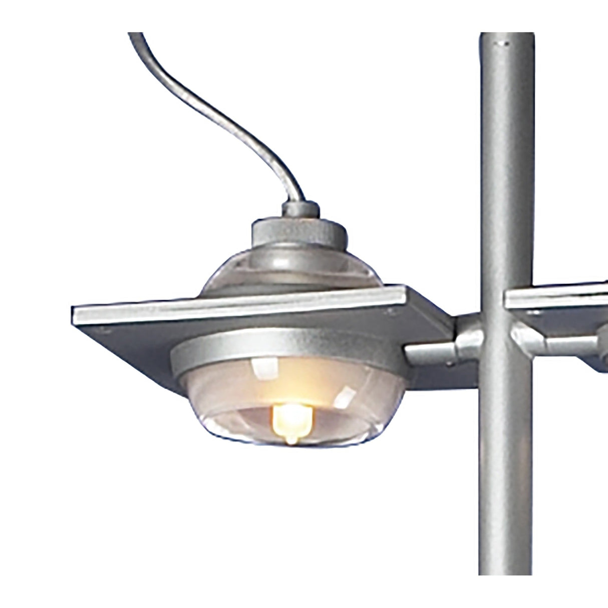 Close-up of the Ull 2 Light Floor Lamp in Silver, featuring a metallic finish with two round bulbs encased in glass and a flat, square metal shade—an industrial-inspired design that enhances any outdoor area.