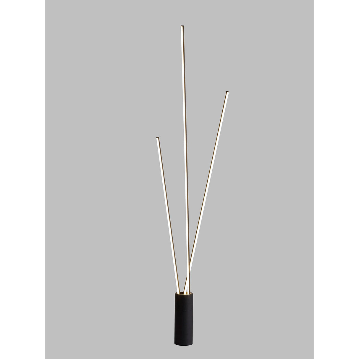 The Vertical Dimmable LED Floor Lamp 60W 3000K – Black features three slender, angled light rods rising from a cylindrical base, offering modern ambient lighting against a plain gray background.