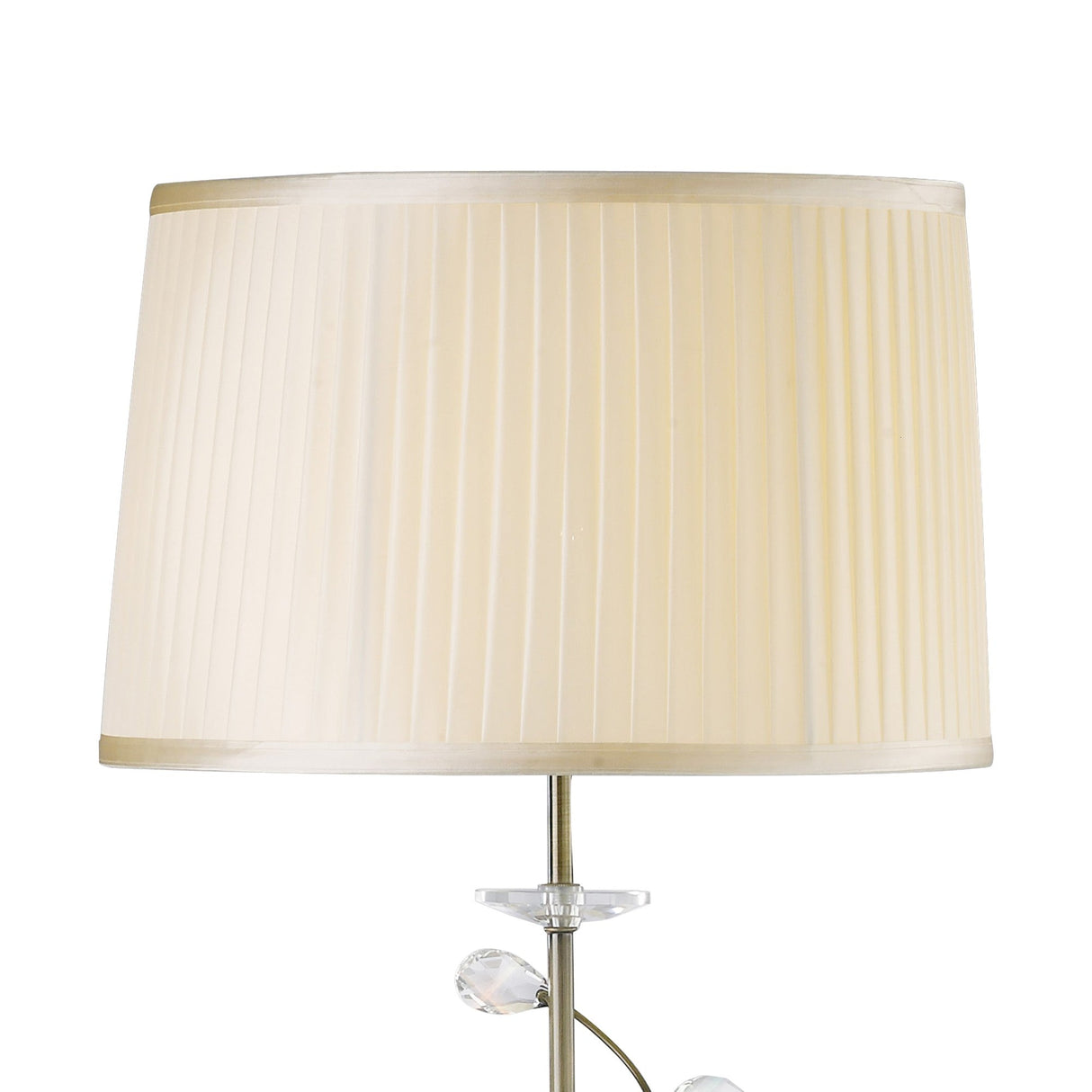 The Willow 1 Light Crystal Floor Lamp features an antique brass base and a cream pleated shade with a subtle vertical pattern, shown against a white background.