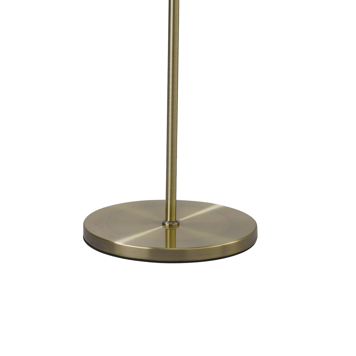 A close-up of the round, brushed brass base and slender pole of the Willow 1 Light Crystal Floor Lamp in brass with a white shade, set against a white background.