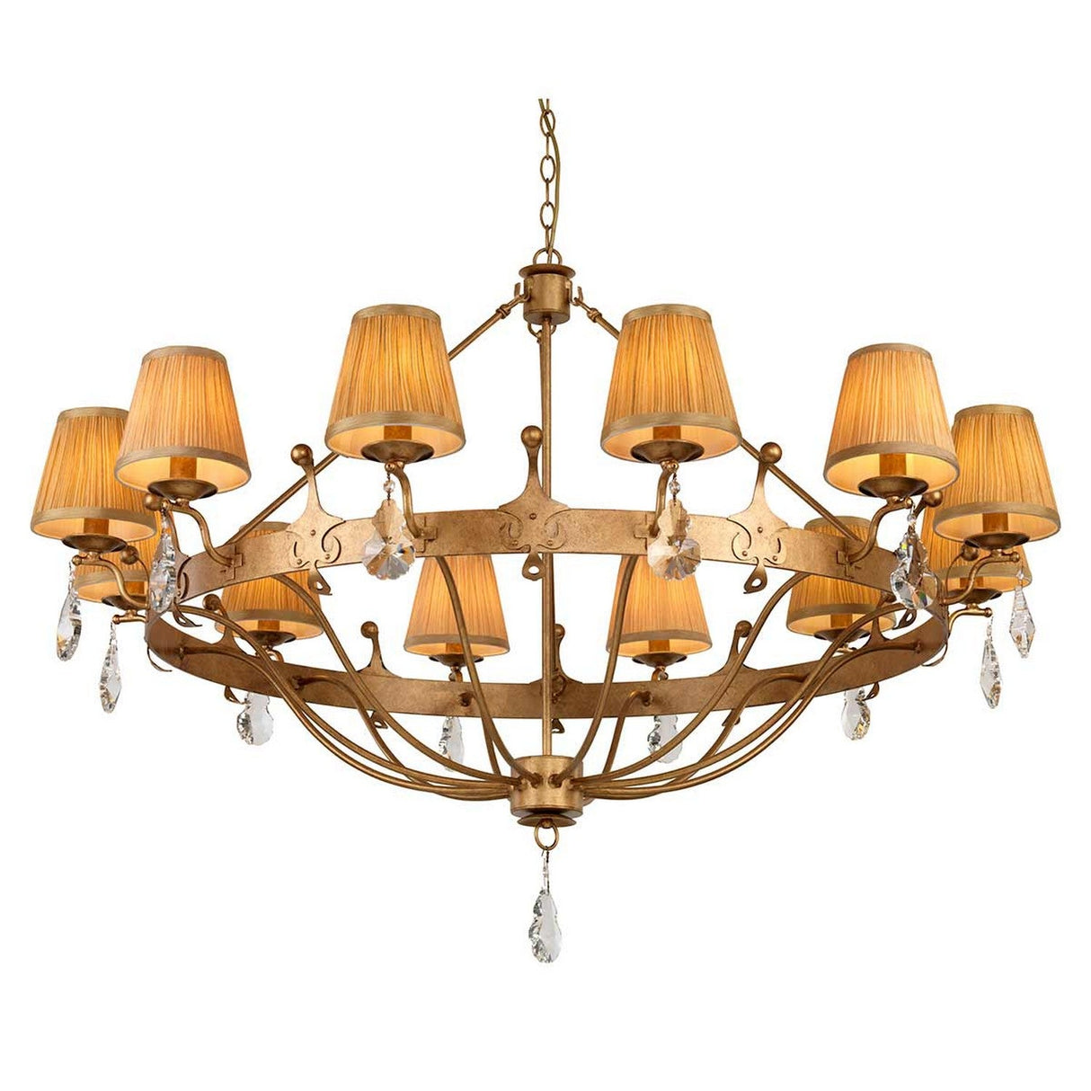 The Windsor 12 Light Chandelier - Gold Patina highlights British craftsmanship with a luxurious gold patina finish, featuring twelve cream-colored lampshades arranged in a circular pattern. Elegant crystal pendants hang between the shades, enhancing its sophistication. The ornate fixture is gracefully suspended by a chain.
