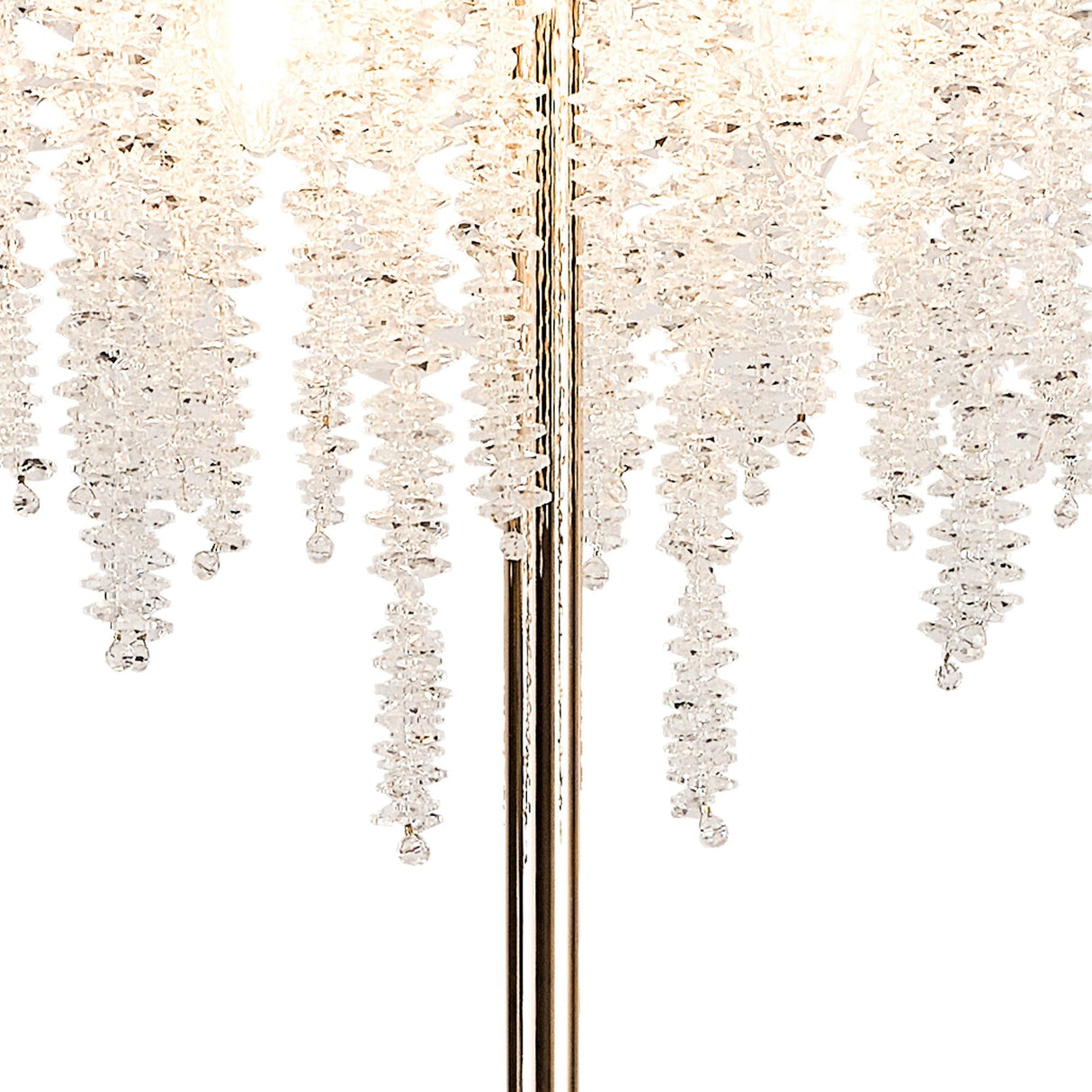 A close-up of the Wisteria 4 Light Crystal Floor Lamp in French Gold, featuring cascading spiral clear crystal strands from a central metallic pole for an elegant, sparkling effect that enhances ambient lighting.