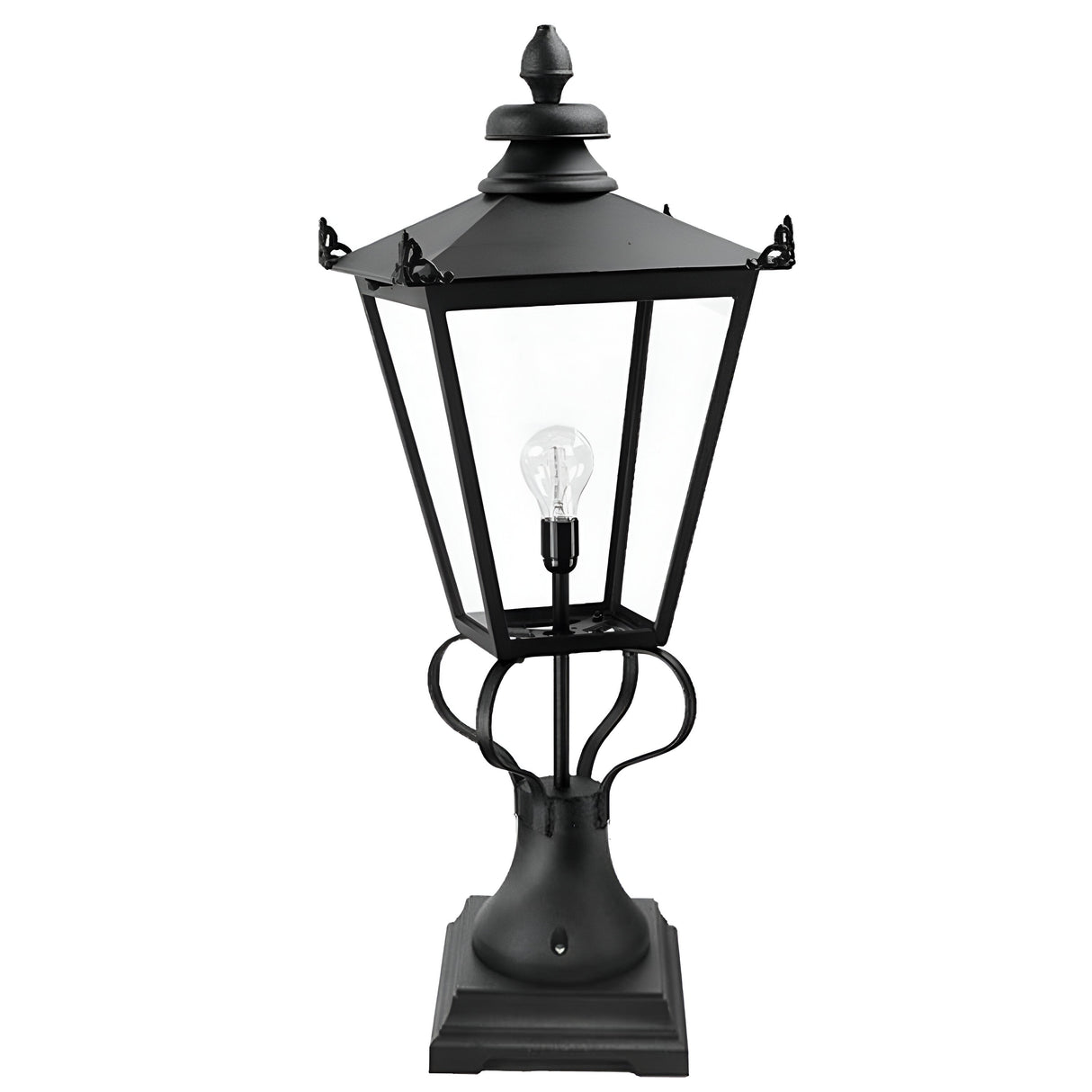 The Wilmslow 1 Light Pedestal Light - Black features a Victorian-style design with a black metal frame and clear glass panels, displaying a visible light bulb at its center. It is elegantly mounted on a square base.