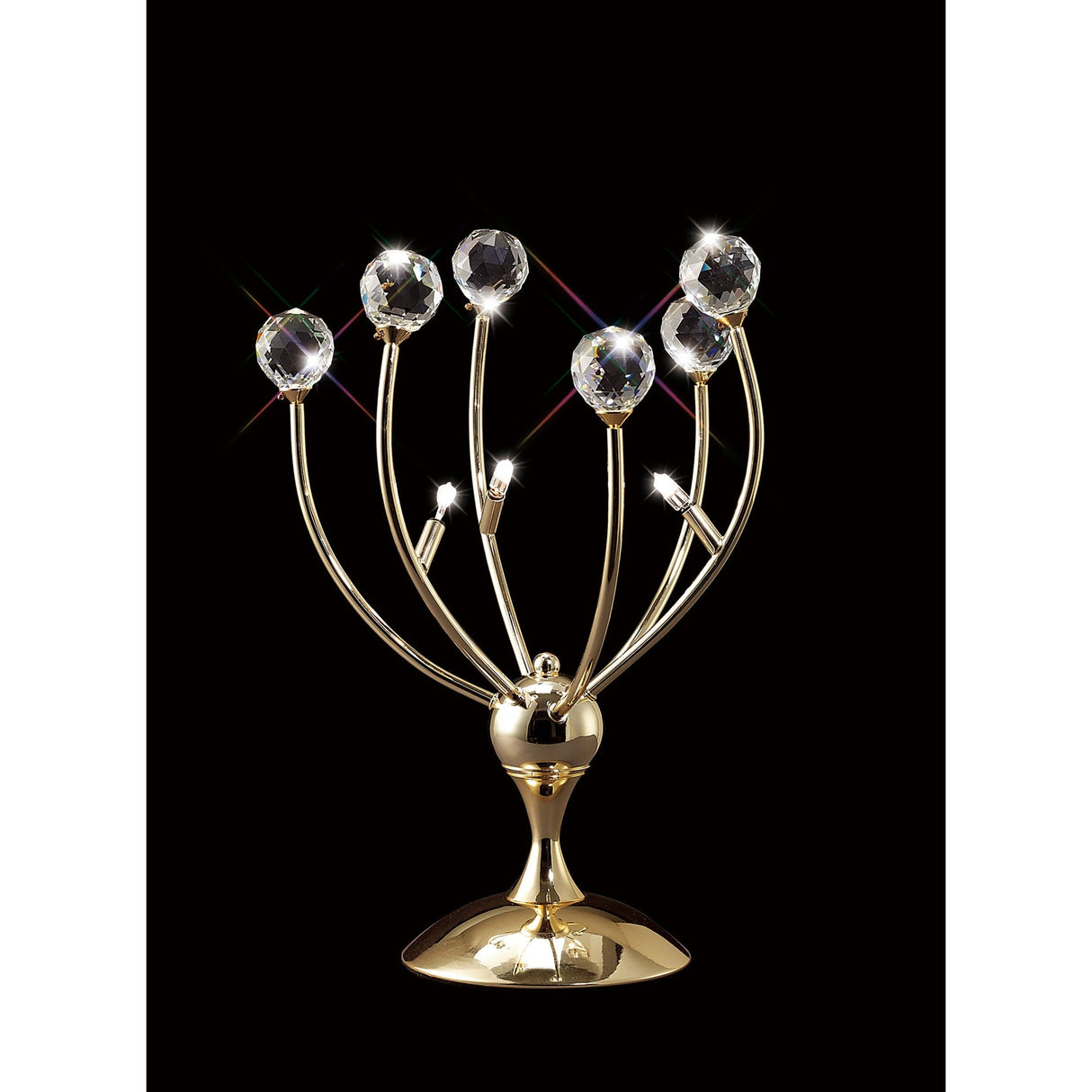 The Xeena 3 Light Crystal Table Lamp in French Gold features curved arms with clear crystal spheres and stands on a shiny round base, creating sparkling light effects for a modern touch against a black background.