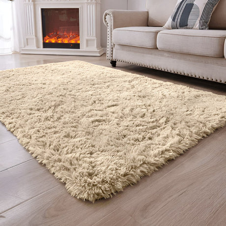 Soft beige shag rug laid in a living room with a fireplace and sofa, creating a warm and inviting floor space.
