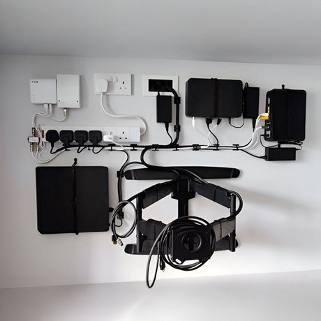 A black cable with three exposed copper wires at the end, each insulated with a different color: blue, green-yellow, and brown, against a white background.