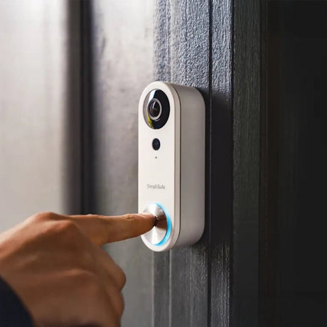 A Lloytron wireless doorbell set with a sleek, modern design. The set includes a push button transmitter and a plug-in receiver, both featuring a circular button and LED indicators.