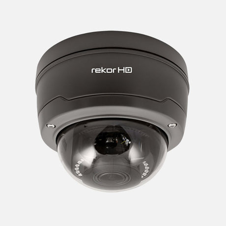 A white dome security camera with the label HDView is mounted on a surface. Its black lens is encased in a clear, protective cover.
