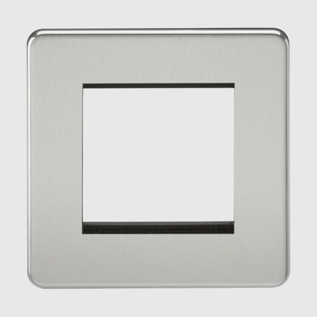 A brushed metal wall plate with openings for nine rectangular light switches, arranged in three rows of three. Each opening is bordered with screw holes for installation.