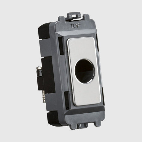 A rectangular metallic light switch with a sleek design, featuring a central circular opening, mounted within a gray and black plastic frame.