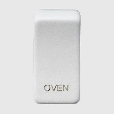 A silver, rectangular fridge magnet with rounded edges and the word FRIDGE engraved on it.
