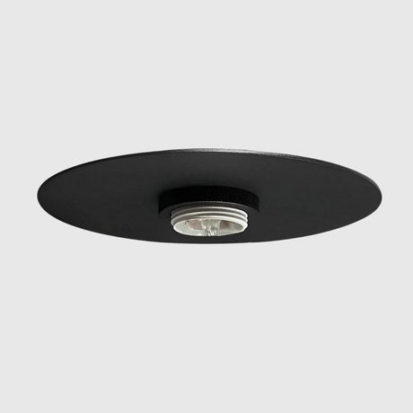 Recessed ceiling light fixture with minimal black trim.