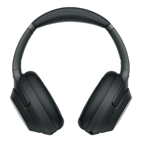 Black over-ear wireless headphones with padded ear cups and headband, facing forward. They have a sleek design and adjustable headband.