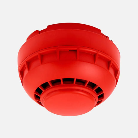 Red alarm button with a circular, raised surface, mounted on a red square base. Four screws are at each corner, securing the device. The central button has a glossy finish, indicating a prominent emergency alert device.