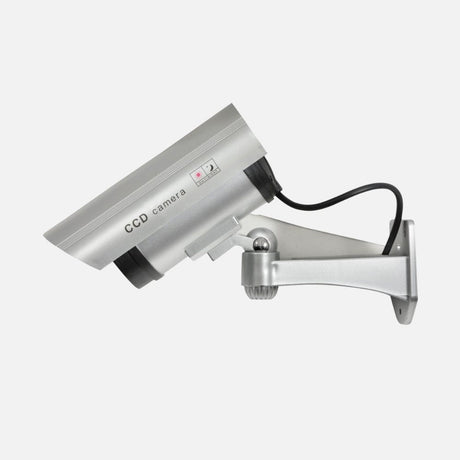 Silver wall-mounted dummy CCTV camera with a black cable and adjustable bracket.