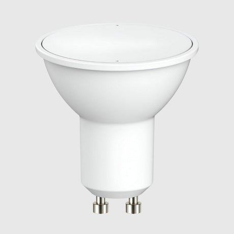 Close-up of a white LED reflector lamp with a GU10 base. The lamp is placed against a plain gray background.