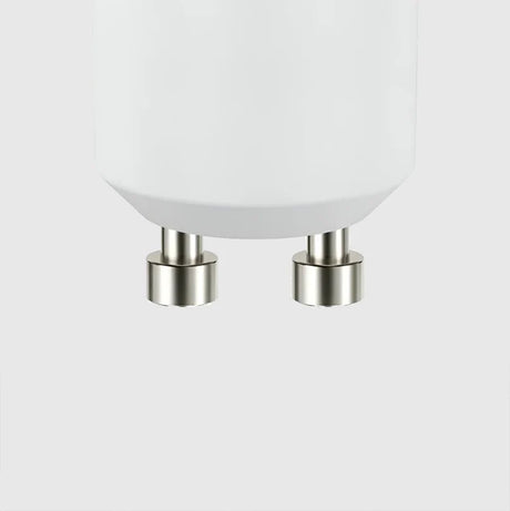A white LED GU10 spotlight bulb on a plain white background. The bulb features a smooth, rounded design with a flat top and two metal prongs at the base.