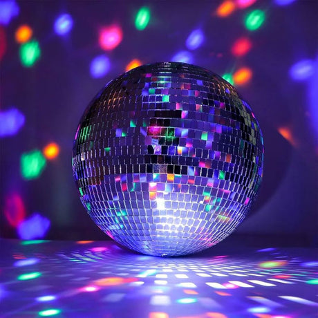 Shiny disco ball reflecting multicolored lights onto the surrounding walls and floor.