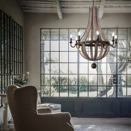Cozy lounge with large grid windows and rustic wooden chandelier.